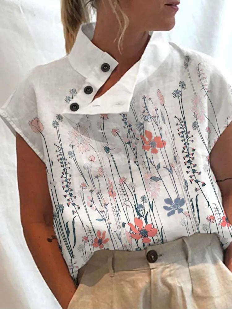 Women's short-sleeve blouse with playful floral print, perfect for summer casual chic.