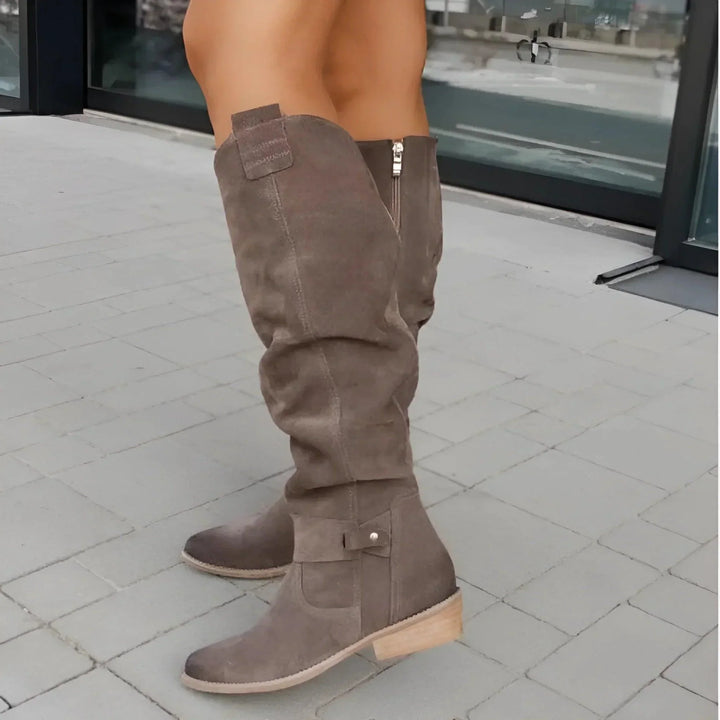 Dark green women's everyday boots, offering sleek style and a comfortable structured fit.