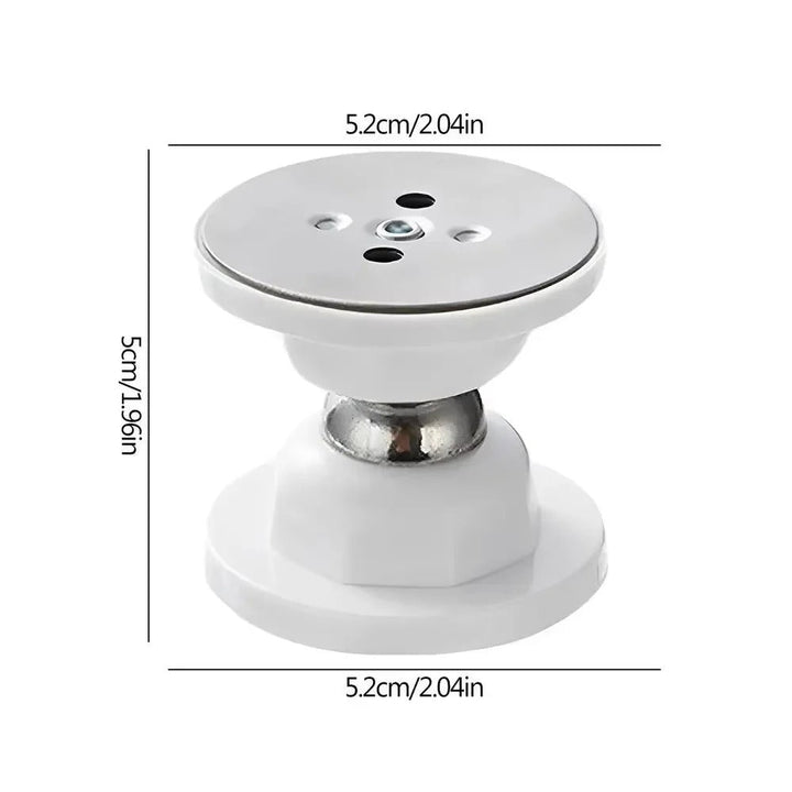 Magnetic door stop securing a door open, mounted on the floor. No-drill installation for home or office doors.