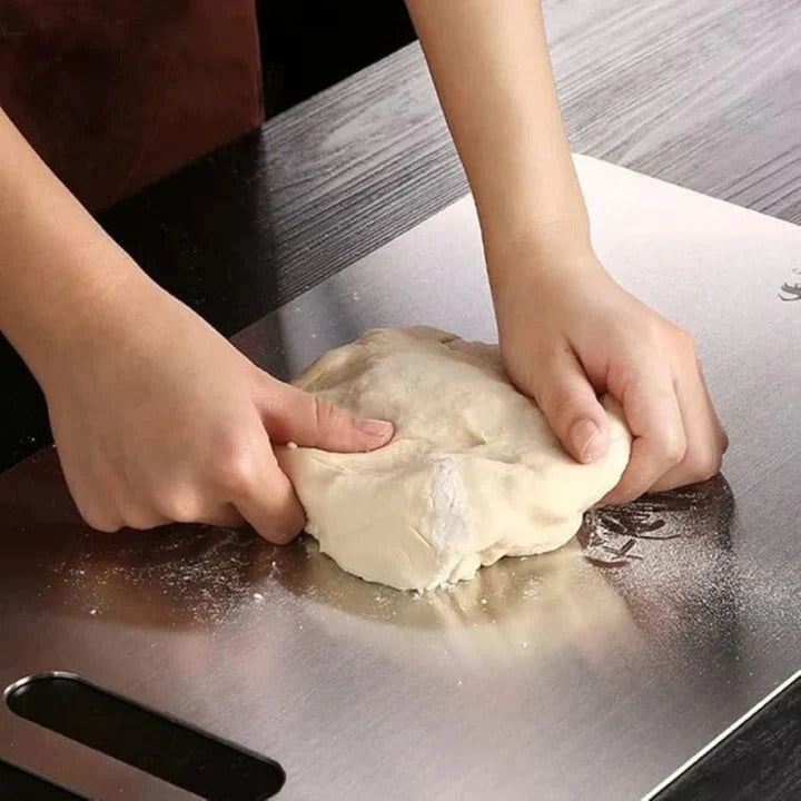 Modern titanium cutting board, sleek and hygienic for daily kitchen food prep. Easy to clean.