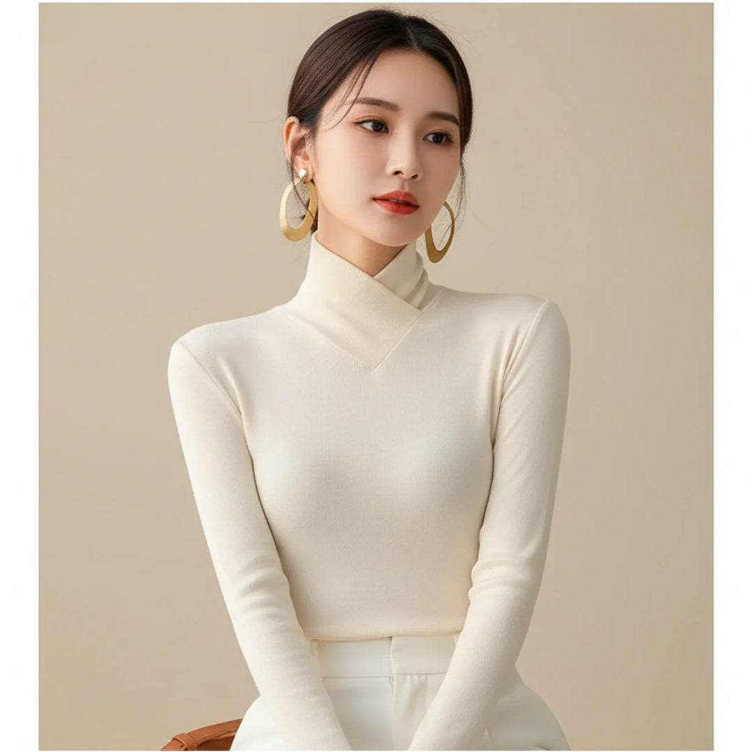 Flattering women's fitted turtleneck sweater in a cozy knit. Essential long-sleeve top for winter fashion & comfort.