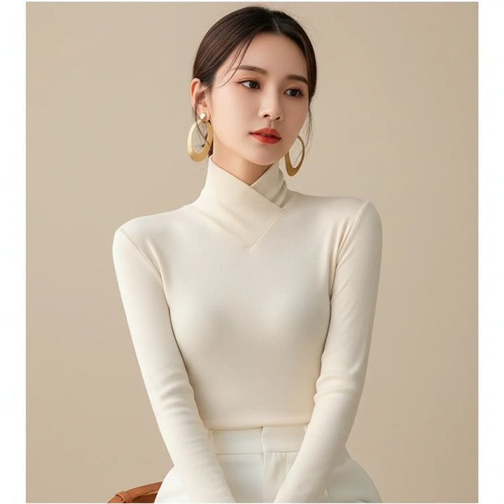 Flattering women's fitted turtleneck sweater in a cozy knit. Essential long-sleeve top for winter fashion & comfort.