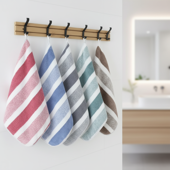 Soft, absorbent coral fleece bathroom towel set. Quick-drying striped polyester for luxurious home decor.
