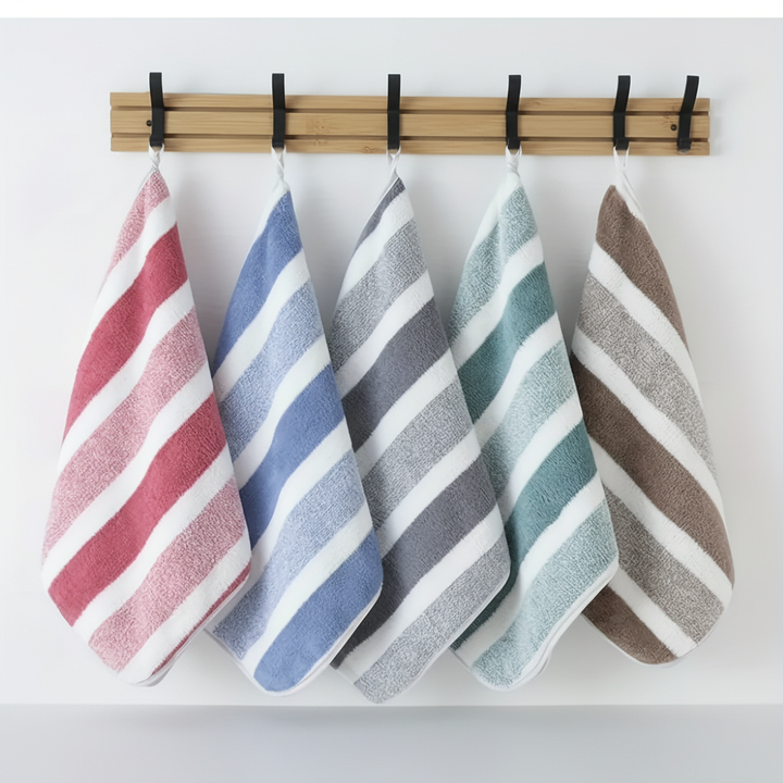 Absorbent coral fleece bathroom towel set. Soft, quick-drying striped polyester towels, great for home decor.