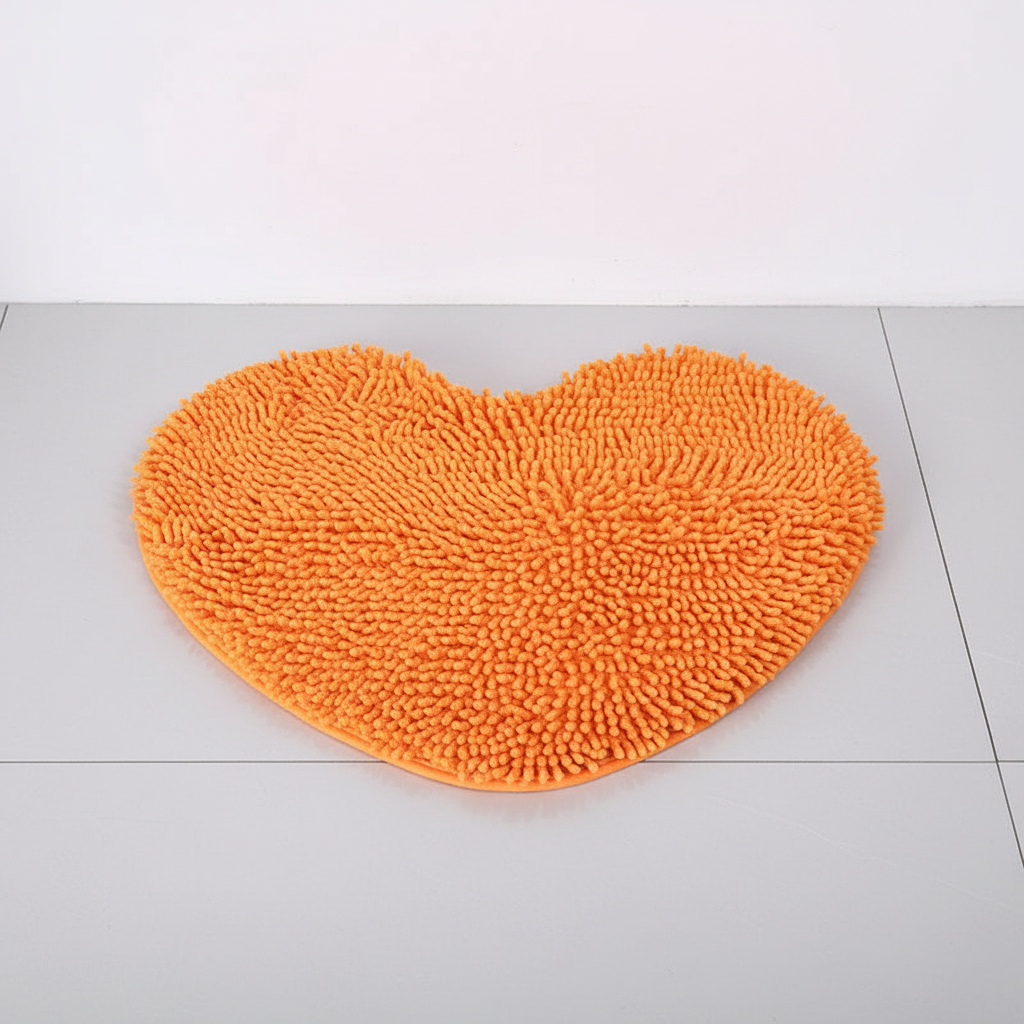 Luxurious heart-shaped microfiber chenille bath mat, perfect for soft, absorbent home comfort.