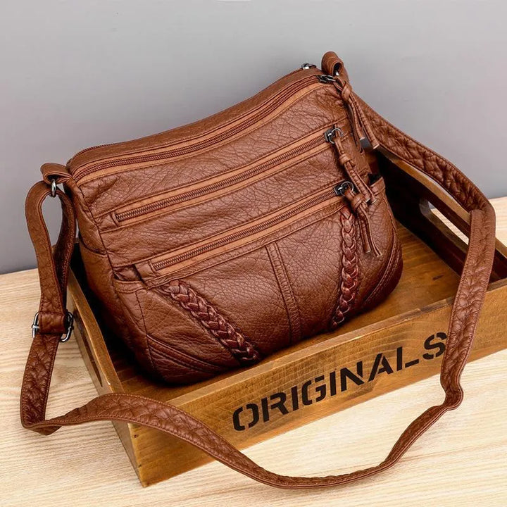 Soft leather everyday shoulder bag for women. Elegant, spacious design, perfect as a stylish handbag and fashion accessory.