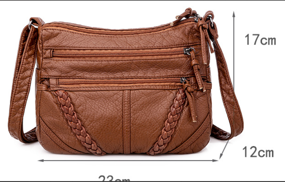 Stylish women's soft leather shoulder bag. Versatile everyday handbag, spacious and an elegant fashion accessory.