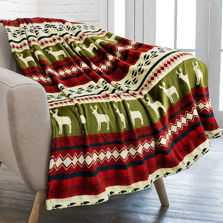 Cozy holiday plush throw blanket featuring a vibrant Nordic reindeer & snowflake design, ideal for festive home decor.