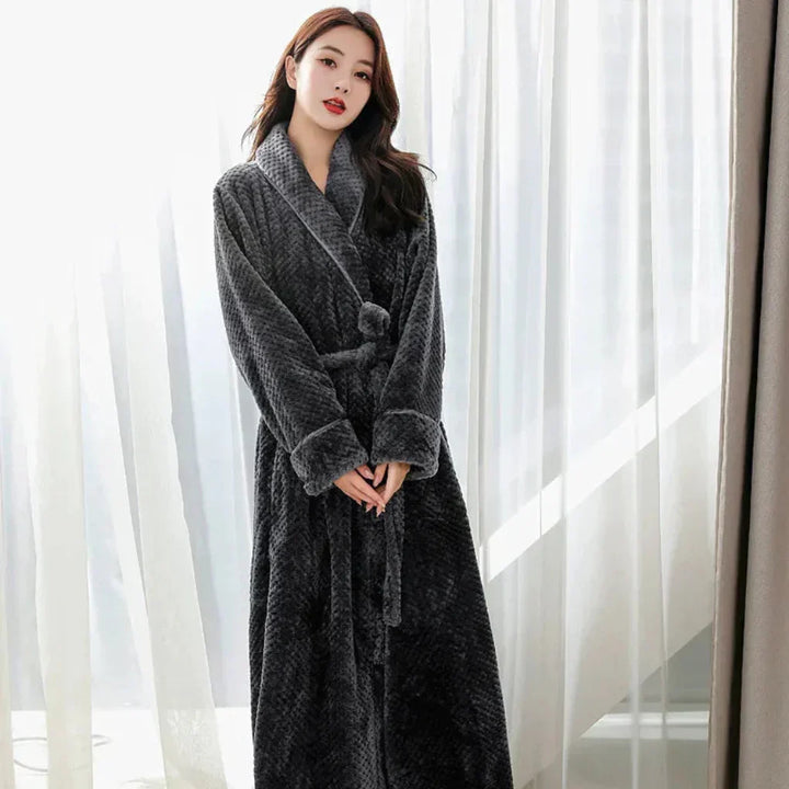 Cozy women's hooded plush bathrobe, ideal for winter relaxation & warm loungewear comfort.