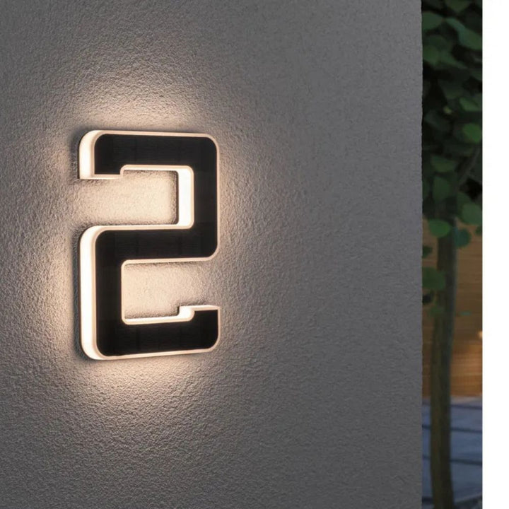 Energy-efficient solar LED house numbers, bright for night visibility & essential delivery aid.