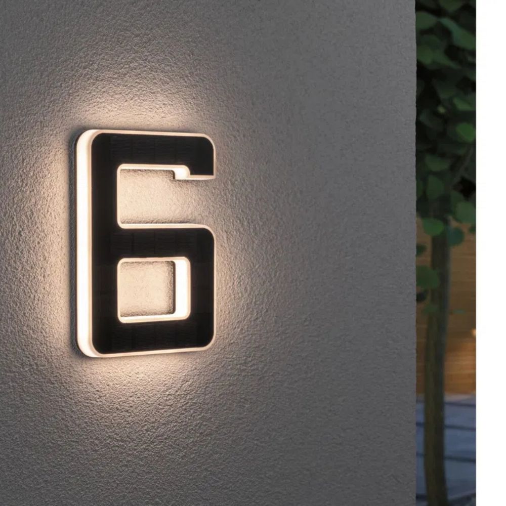 Front view of modern solar house number sign, lit for evening visibility, sleek home exterior decor.