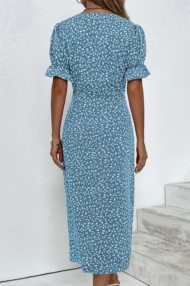 Women's relaxed fit pleated midi dress, perfect for sophisticated day and evening outfits.
