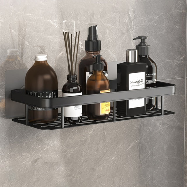 Space-saving metal suction bathroom organizer shelf for shower essentials & storage.
