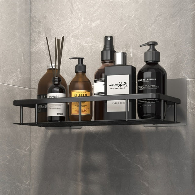 Empty silver metal suction shower caddy, ready for easy installation on tile wall.