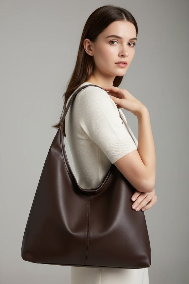 Versatile coffee-colored women's handbag. A stylish and spacious everyday carryall shoulder bag for fashion accessories.