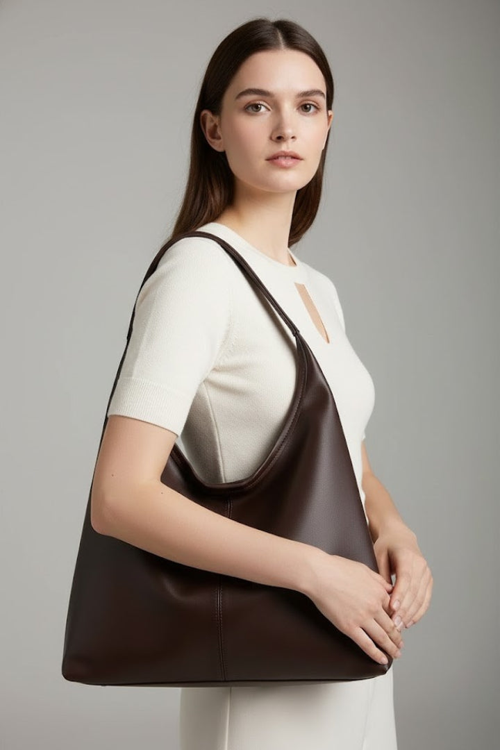 White women's shoulder bag, a chic and spacious everyday tote. Perfect for carrying essentials in an organized fashion.