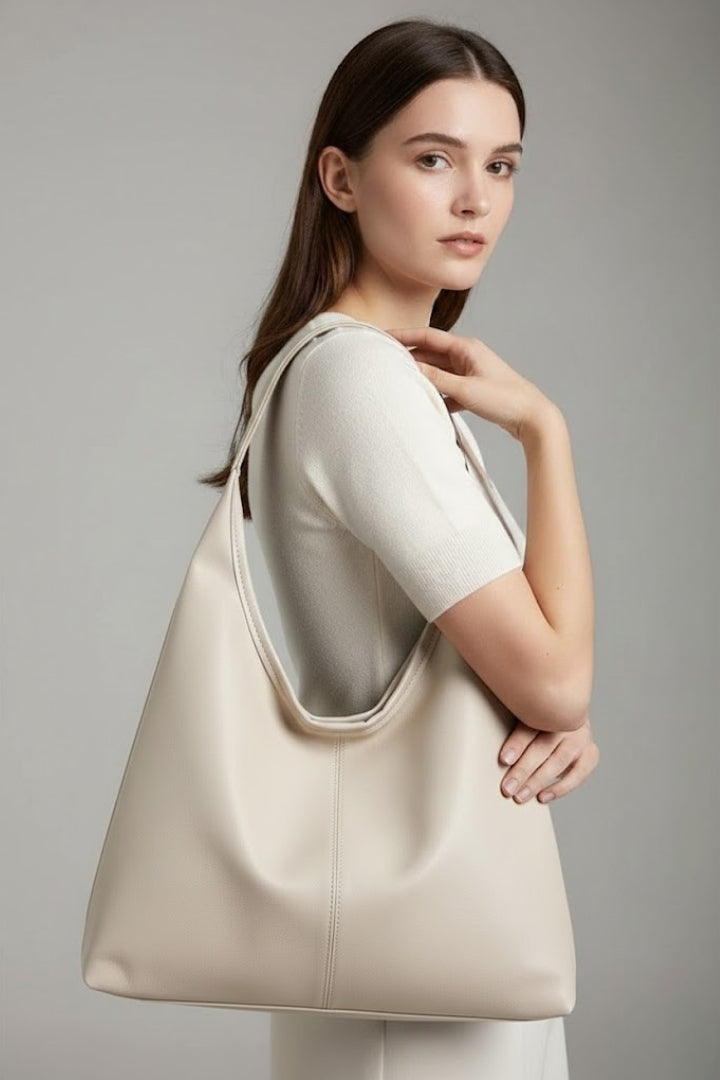 Stylish brown women's tote, a spacious and organized everyday carryall handbag, perfect for work or leisure.