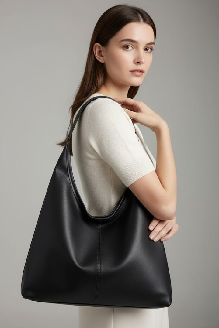 Fashionable white women's handbag, a spacious everyday shoulder bag designed for versatility and elegant accessories.