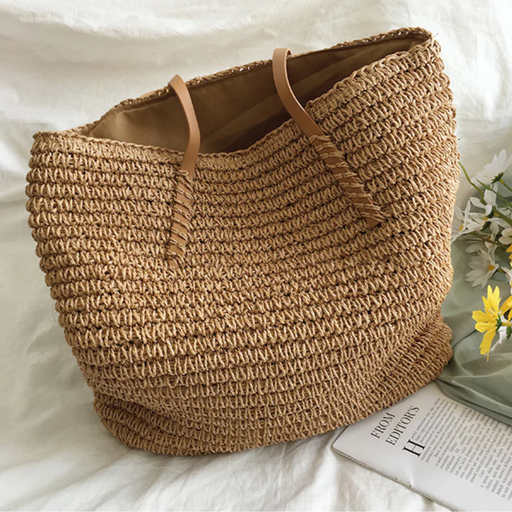 Spacious women's TerraWoven handbag with elegant woven design and sturdy shoulder strap, perfect for daily use.