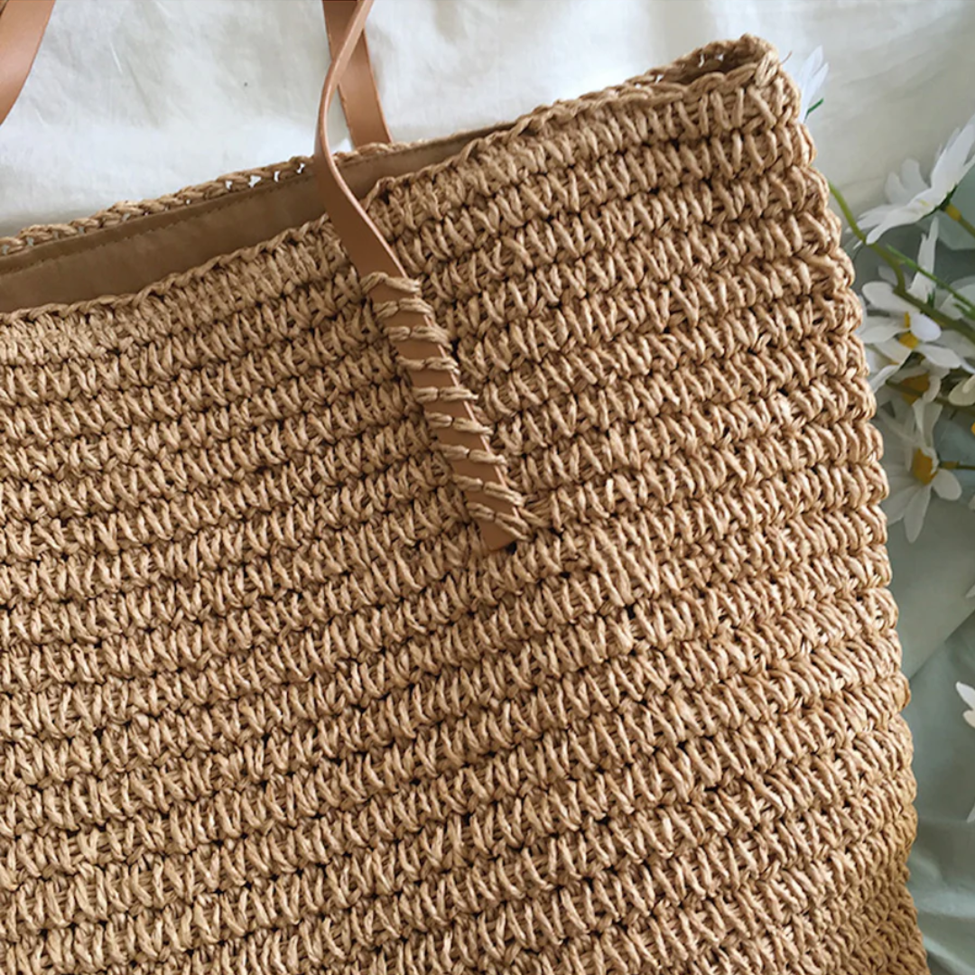 Elegant TerraWoven purse for women, featuring a unique woven design and a sturdy strap for versatile daily carrying.