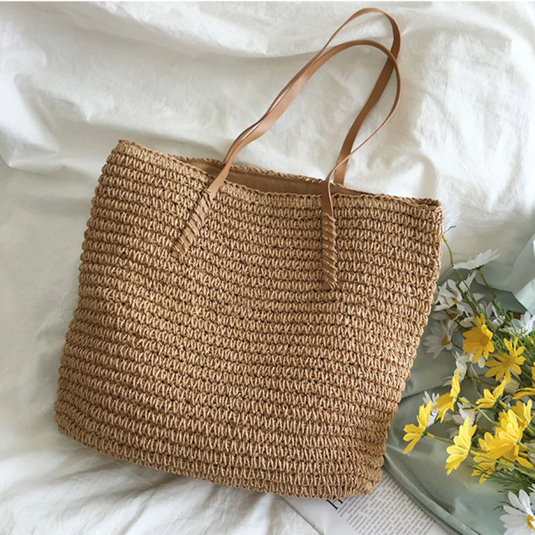 Spacious brown TerraWoven handbag for women, an elegant fashion accessory with a beautiful woven texture.