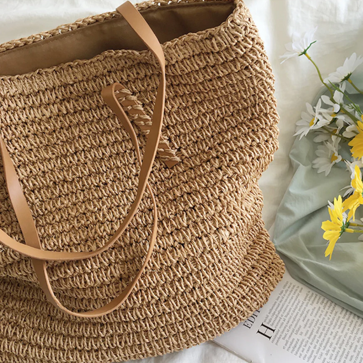 Stylish white TerraWoven handbag for women, a spacious and sturdy daily carryall with a comfortable shoulder strap.