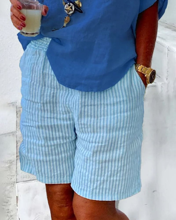 Comfortable mid-rise striped shorts for women, ideal for summer fashion and relaxed beachwear.