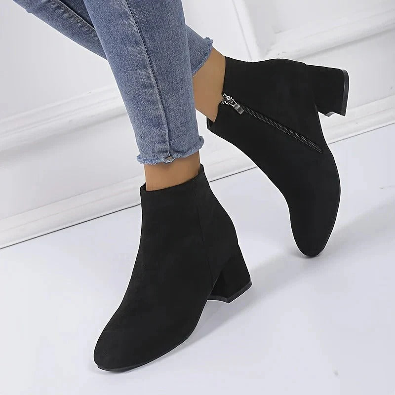 Classic women's ankle boots with a fashionable block heel and side zip, great for everyday fall/winter outfits.