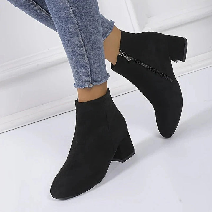 Classic women's ankle boots with a fashionable block heel and side zip, great for everyday fall/winter outfits.