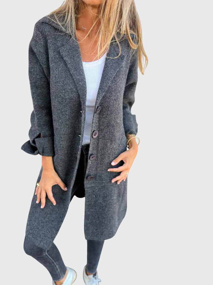 Close-up of the soft, cozy fabric of a women's longline blazer, ideal for comfortable layering.