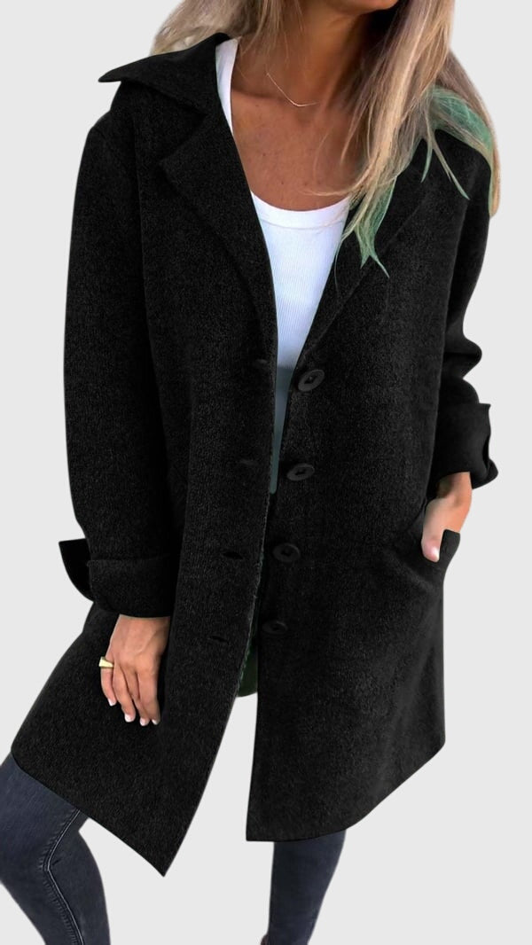 Side view of the women's stylish longline blazer, highlighting its elegant drape and versatile layering.