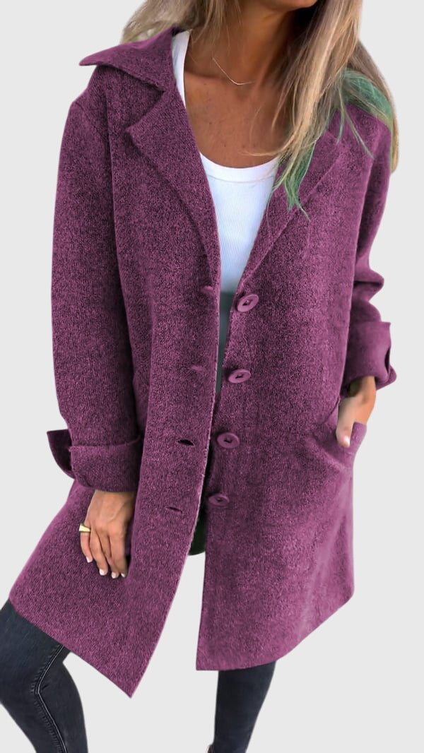 Women's cozy longline blazer with hands in pockets, emphasizing relaxed fit & casual stylish appeal.