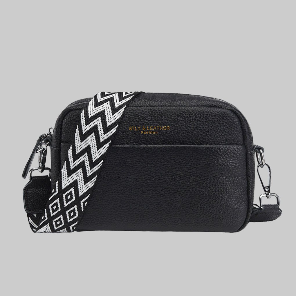 Stylish women's crossbody bag with unique geometric strap. Versatile fashion accessory for everyday use.