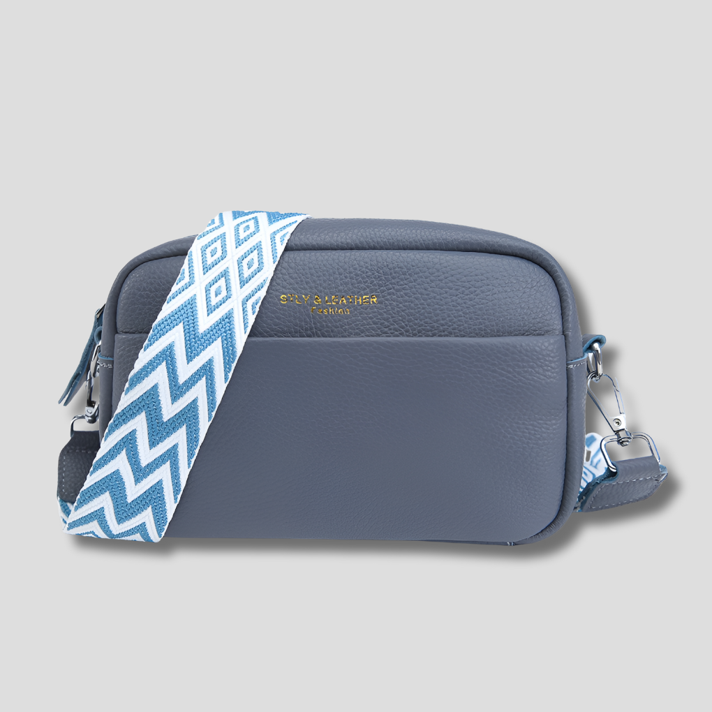 Elegant black women's crossbody bag with a trendy geometric strap. Perfect organized shoulder bag.