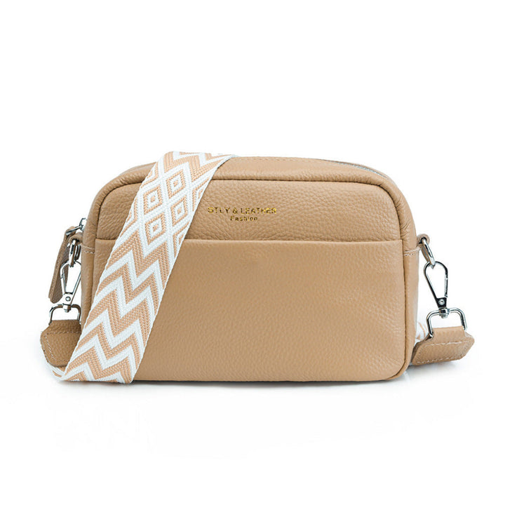 Khaki women's crossbody bag featuring a stylish geometric strap. An elegant and versatile everyday bag.