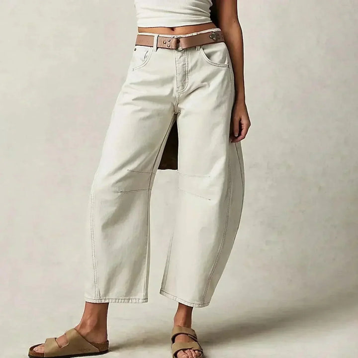 Close-up of comfortable women's high waist wide leg jeans fabric, highlighting relaxed fit & quality for everyday wear.