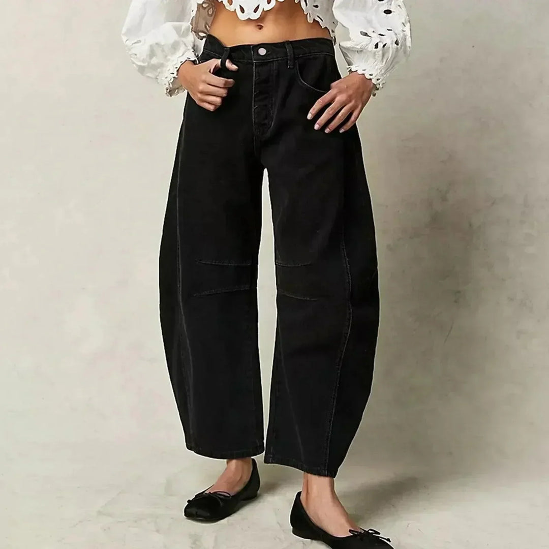 Back view of women's high waist wide leg jeans, featuring a flattering fit and comfortable, relaxed silhouette. Stylish.