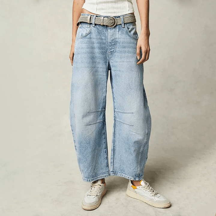 Full-length view of women's high waist wide leg jeans, showing the elegant flow and relaxed fit for versatile style.