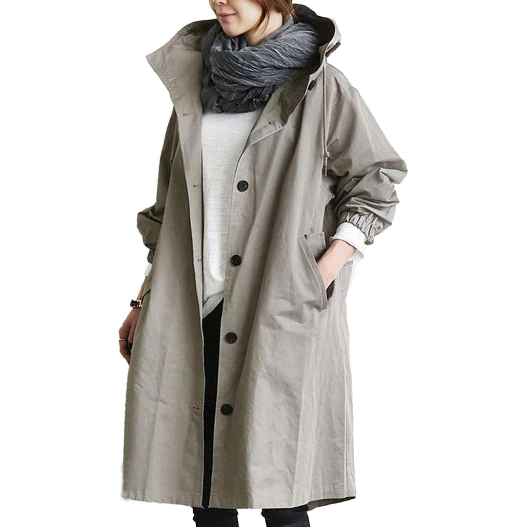 Elegant women's waterproof long raincoat, combining chic style with practical weather protection.