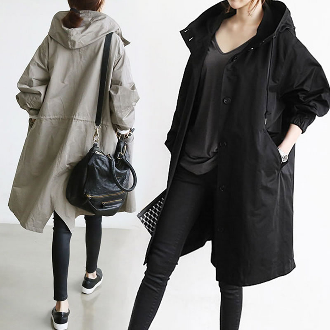 Fashionable women's long waterproof raincoat, keeping you dry and stylish in any weather condition.