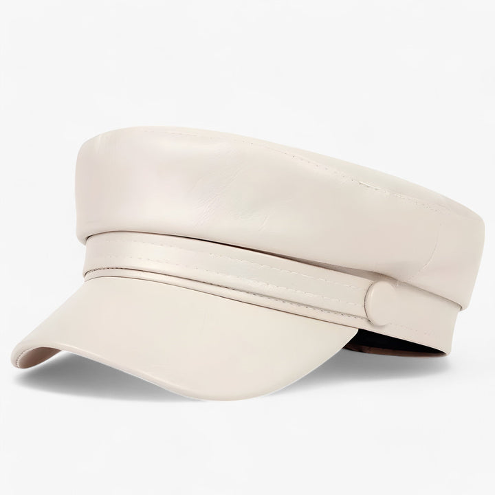 Woman wearing a black octagonal flat cap, stylish PU leather driving hat for a chic fall winter look.