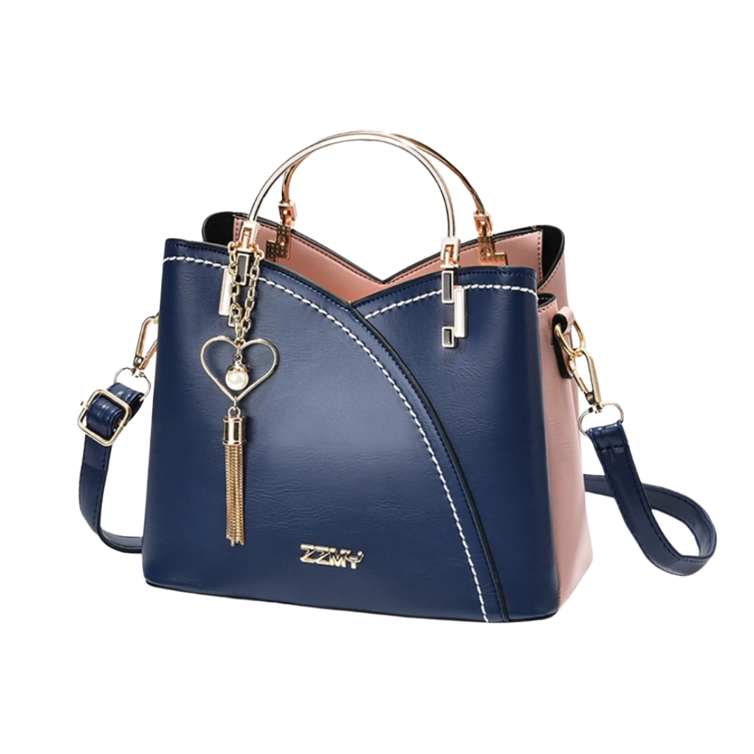 Fashionable patchwork tote bag for women, featuring a trendy tassel charm. Great as a stylish shoulder handbag.