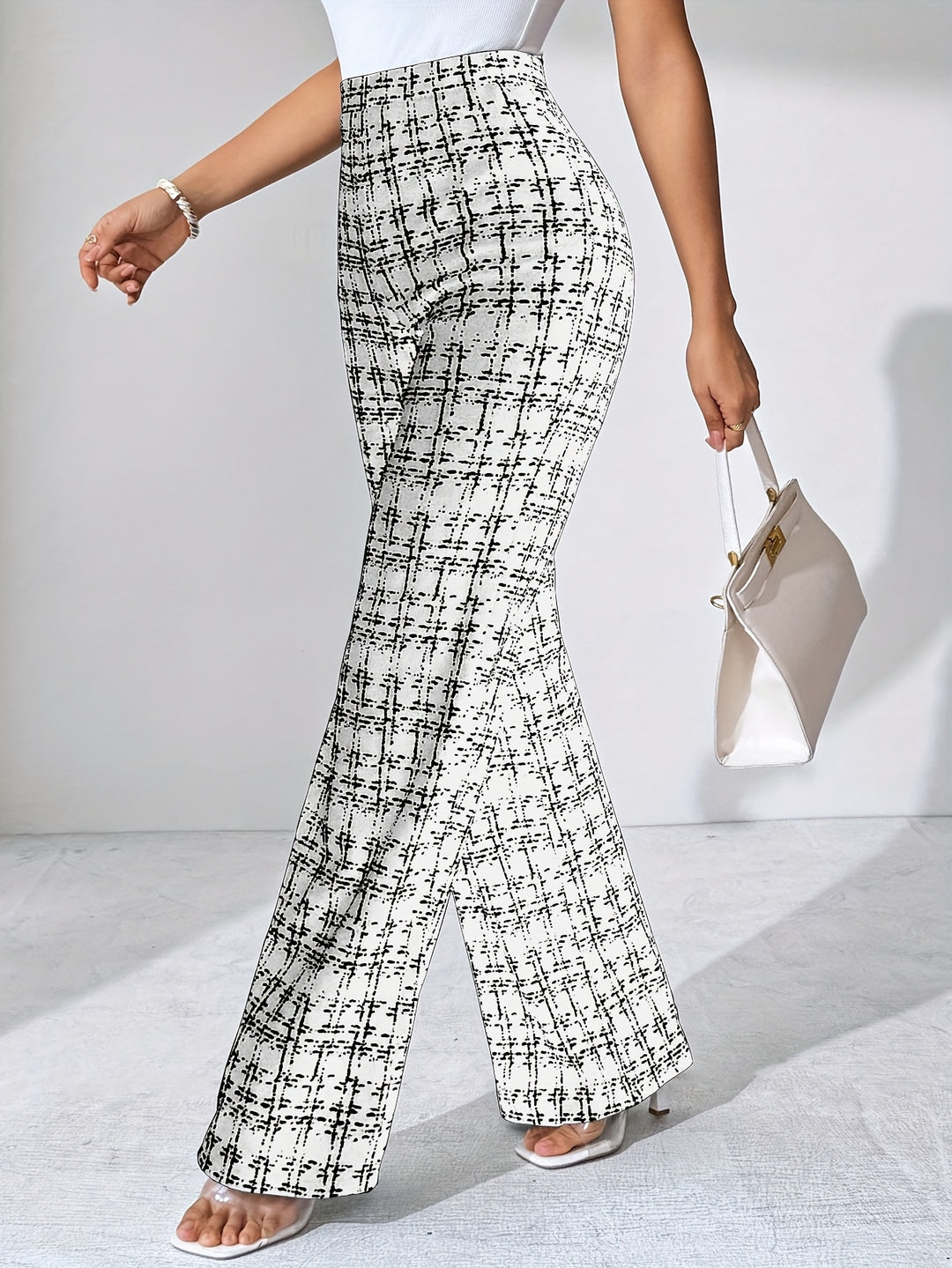High-waisted women's knit plaid pants, a versatile addition to any wardrobe, flared cut.