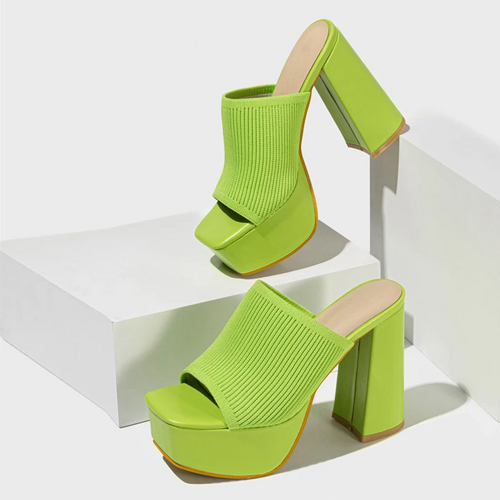 Fashion-forward women's heeled platform sandals, stylish and comfortable footwear for summer.