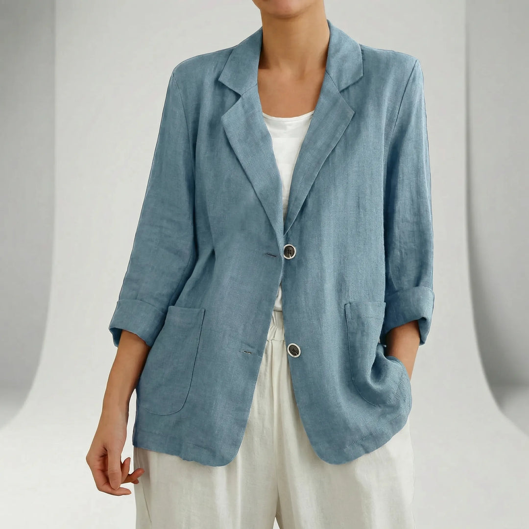 Relaxed fit women's blazer featuring three-quarter sleeves and patch pockets, perfect for chic spring/fall fashion.