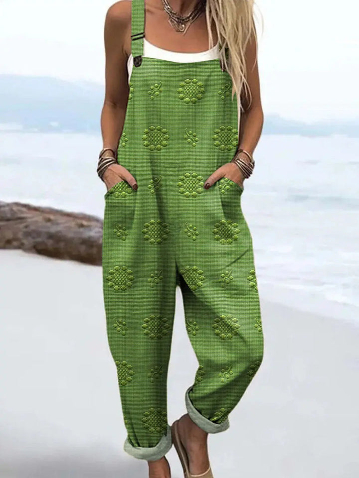 Comfortable women's pattern jumpsuit with adjustable straps, wide leg, and pockets for versatile style.