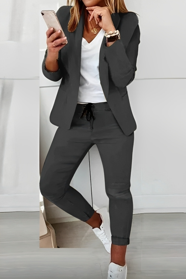 Stylish women's two-piece suit set, featuring a tailored blazer and matching pants for a chic business casual look.