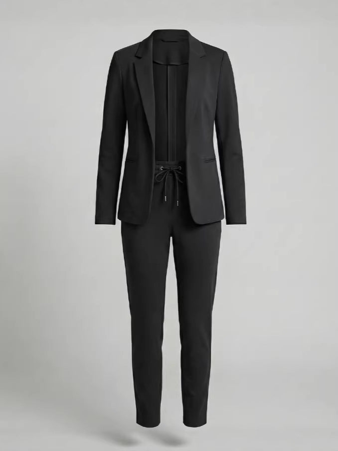 Modern women's chic two-piece suit set, a stylish blazer and comfortable pants for contemporary fashion.
