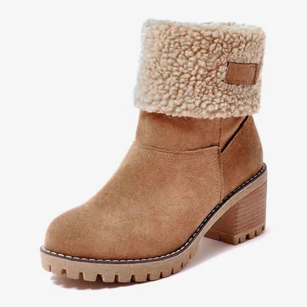 Elegant women's winter snow boots featuring a sturdy block heel, offering warmth and waterproof protection.