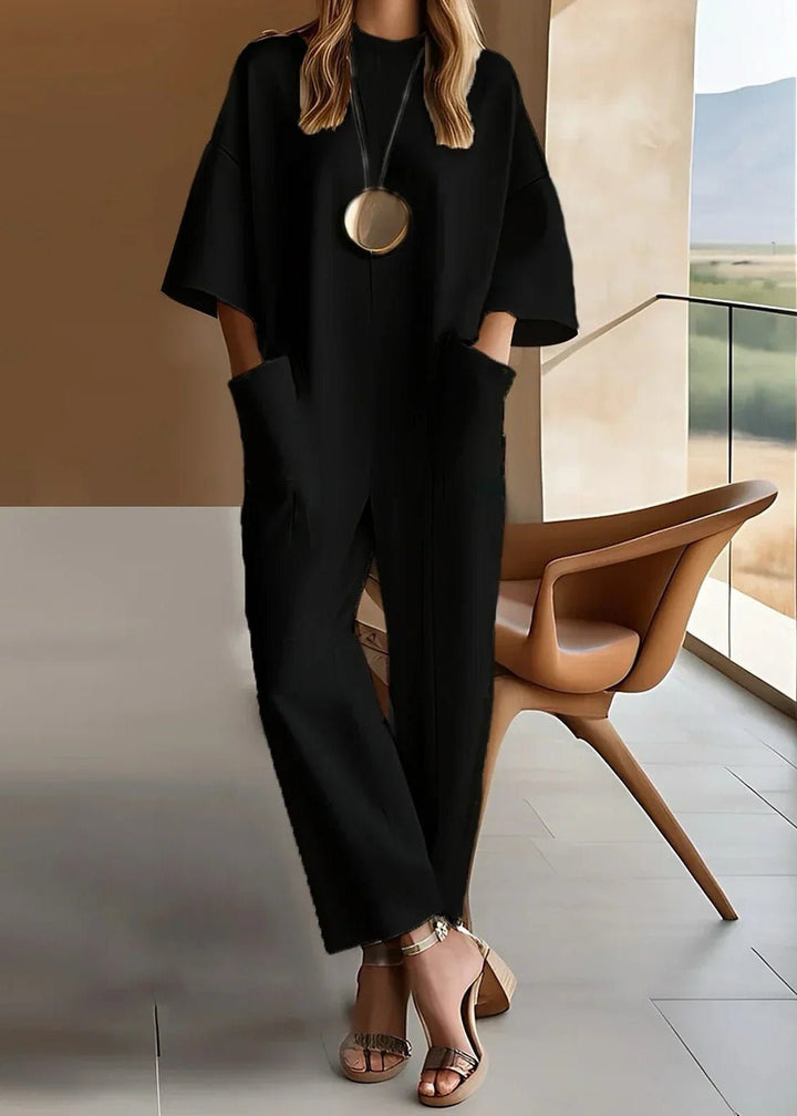 Elegant women's one-piece wide leg jumpsuit with short sleeves & crew neck. Versatile & comfortable.
